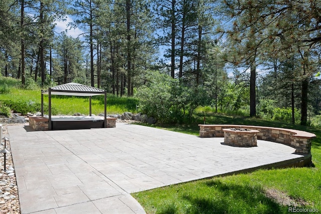 view of patio / terrace featuring a fire pit and a gazebo