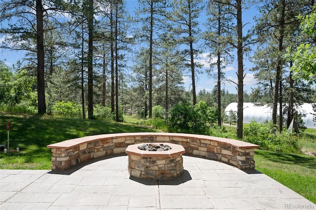 view of patio featuring an outdoor fire pit