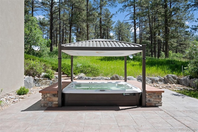 view of patio featuring an outdoor hot tub