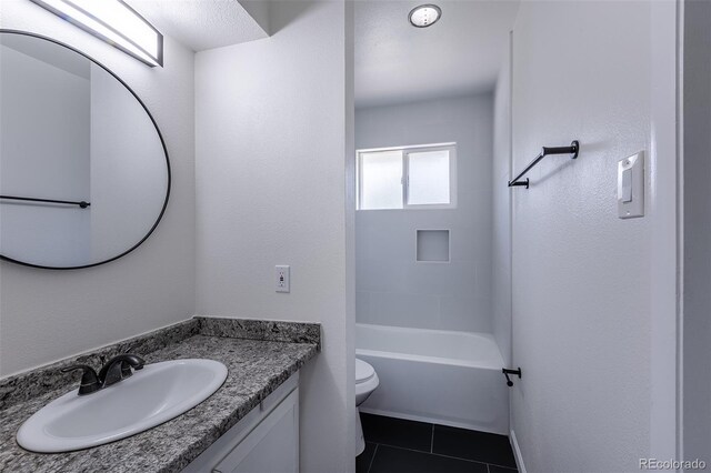 2120 S Ouray St, Aurora, CO 80013 - bathroom featuring toilet, vanity, and tile patterned floors
