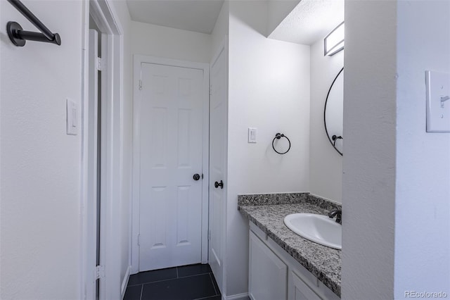 2120 S Ouray St, Aurora, CO 80013 - bathroom with vanity and tile patterned flooring