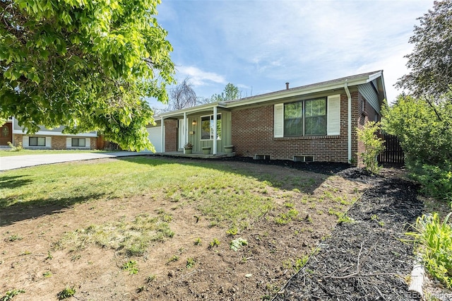2120 S Ouray St, Aurora, CO 80013 - single story home featuring brick siding, concrete driveway, and a garage