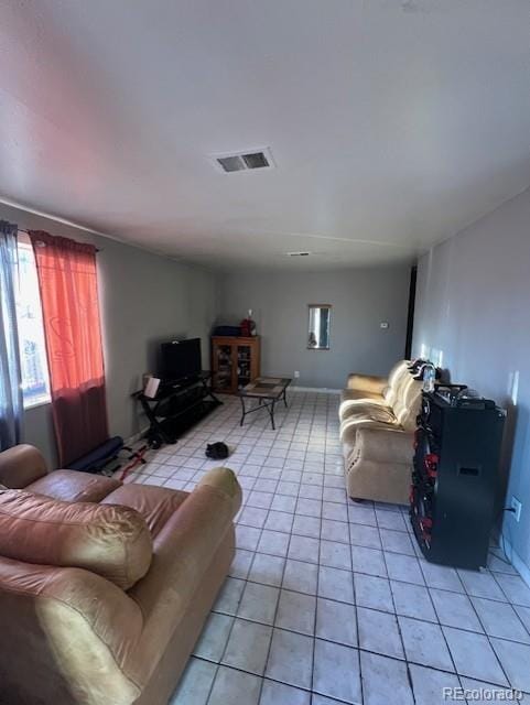 living room with light tile patterned floors