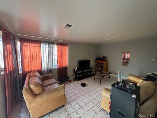 living room featuring light tile patterned flooring