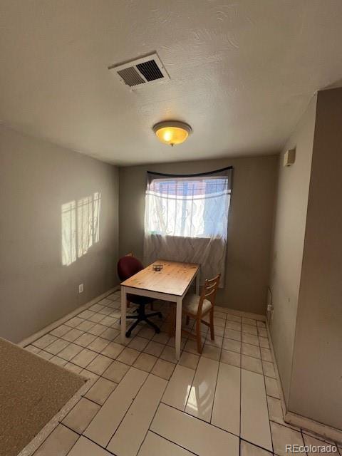dining room featuring light tile patterned floors