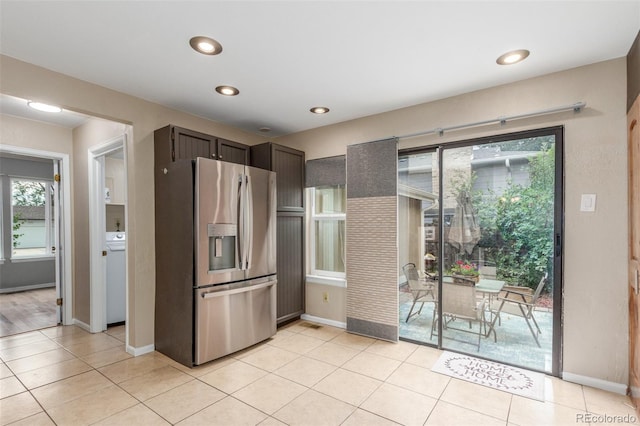 7762 W Ottawa Pl, Littleton, CO 80128 - kitchen featuring stainless steel fridge, plenty of natural light, light tile patterned floors, and recessed lighting
