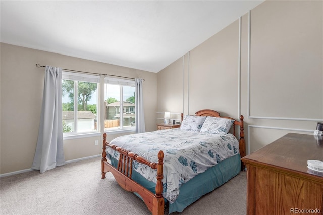 7762 W Ottawa Pl, Littleton, CO 80128 - bedroom with light colored carpet and lofted ceiling