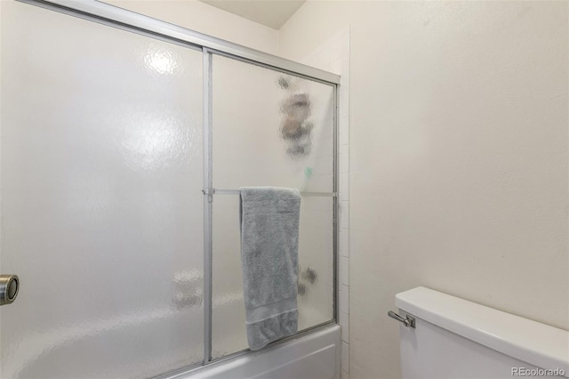 7762 W Ottawa Pl, Littleton, CO 80128 - bathroom featuring toilet and enclosed tub / shower combo