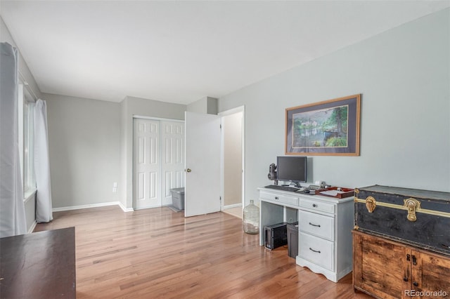 7762 W Ottawa Pl, Littleton, CO 80128 - home office featuring light wood finished floors and baseboards