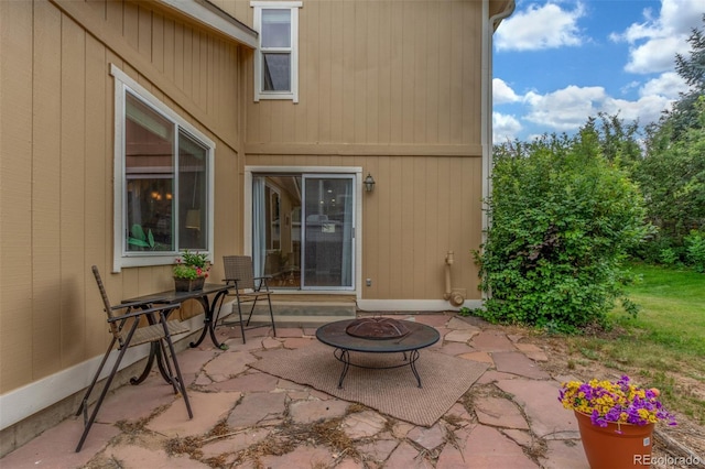 7762 W Ottawa Pl, Littleton, CO 80128 - view of patio / terrace with an outdoor fire pit