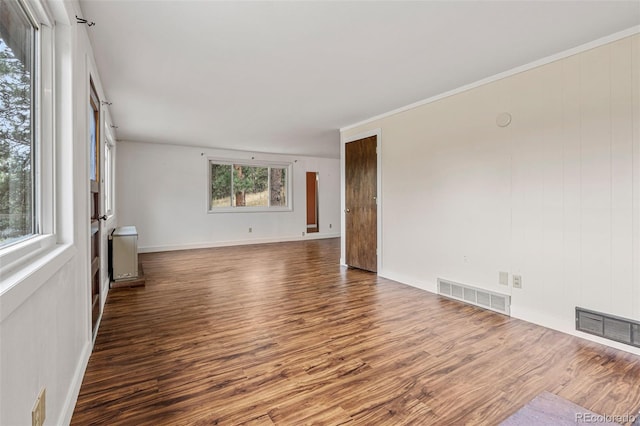 empty room with hardwood / wood-style floors