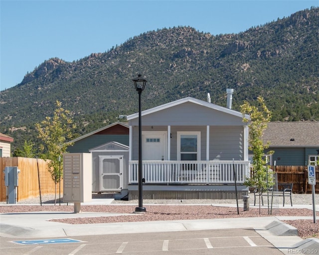 view of front of house featuring a mountain view and a porch