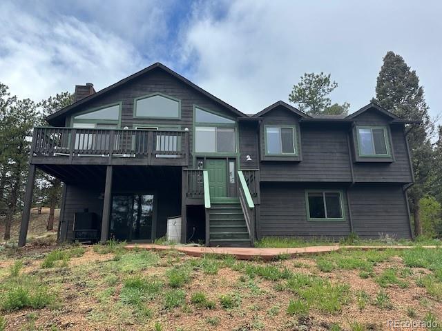 4041 Trout Creed Rd, Woodland Park, CO 80863 - view of front of home with a deck