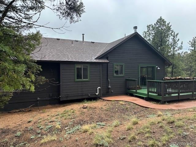4041 Trout Creed Rd, Woodland Park, CO 80863 - back of house featuring a wooden deck and roof with shingles