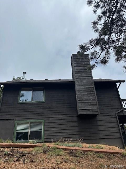 4041 Trout Creed Rd, Woodland Park, CO 80863 - view of side of home with a chimney