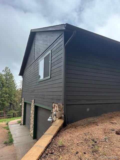 4041 Trout Creed Rd, Woodland Park, CO 80863 - view of side of home with an attached garage