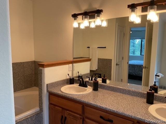4041 Trout Creed Rd, Woodland Park, CO 80863 - ensuite bathroom featuring double vanity and a bath
