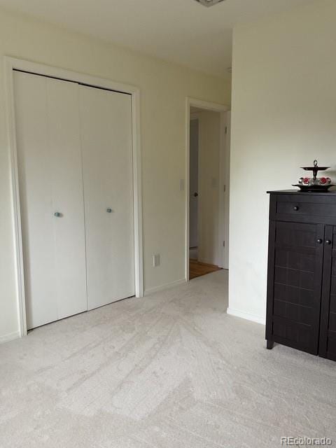 4041 Trout Creed Rd, Woodland Park, CO 80863 - unfurnished bedroom featuring light carpet, a closet, and baseboards