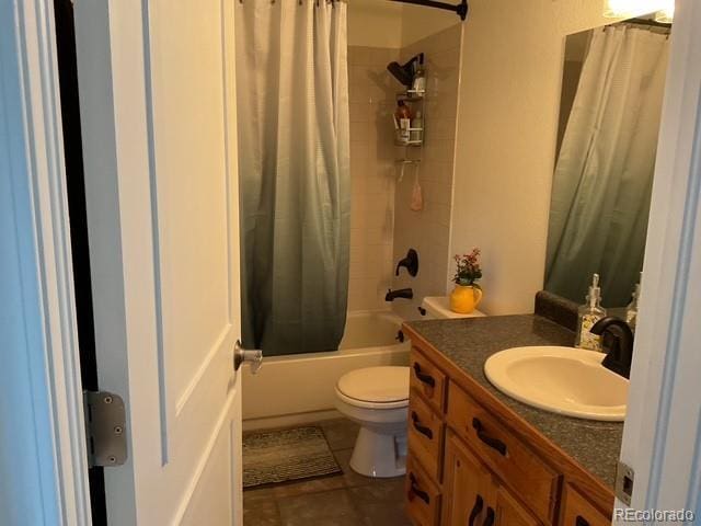 4041 Trout Creed Rd, Woodland Park, CO 80863 - bathroom featuring vanity, toilet, shower / bath combo with shower curtain, and tile patterned flooring