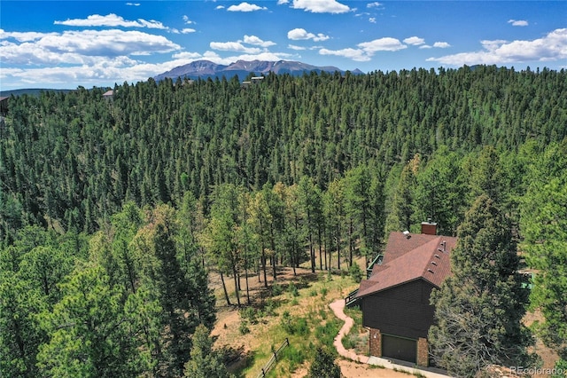 4041 Trout Creed Rd, Woodland Park, CO 80863 - view from above of property with a forest and mountains