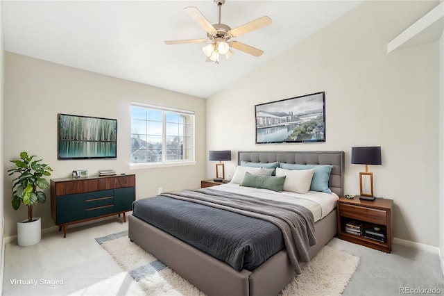 carpeted bedroom featuring ceiling fan and vaulted ceiling