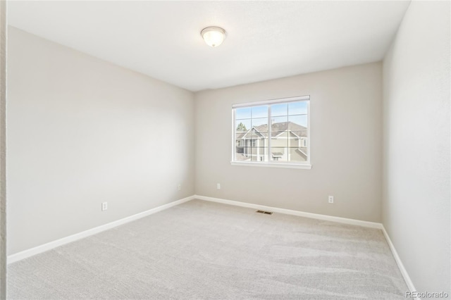 unfurnished room with carpet flooring