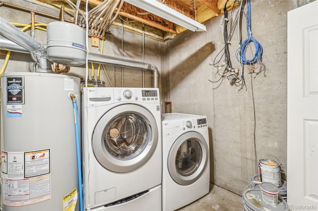 laundry area featuring gas water heater and washing machine and dryer