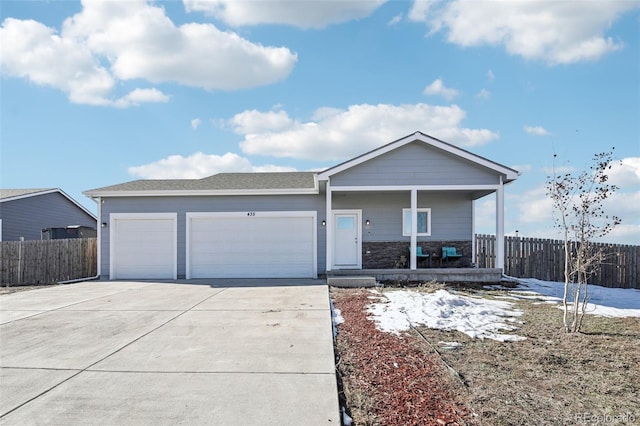 single story home featuring a porch and a garage