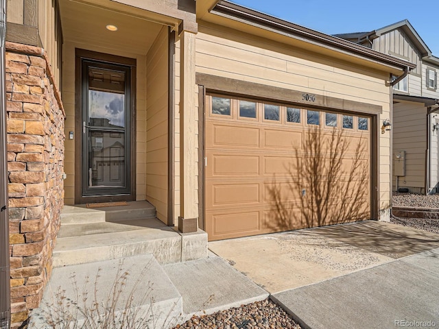 garage with concrete driveway