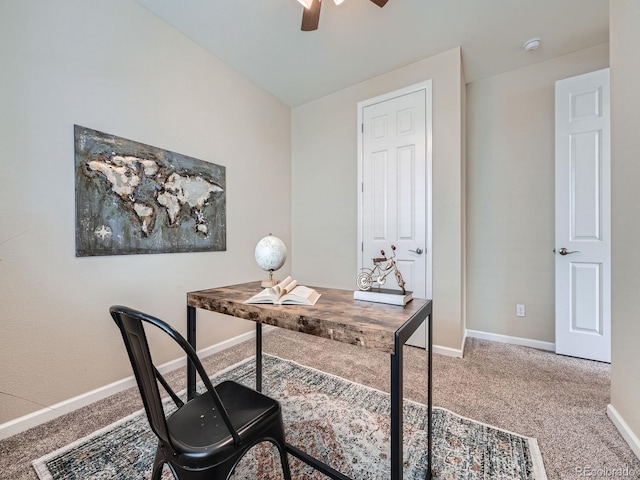 home office with carpet floors, ceiling fan, and baseboards