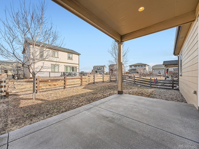 view of patio featuring fence