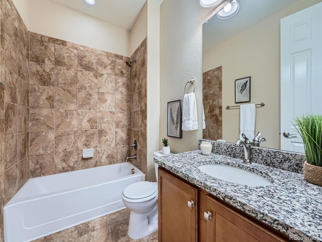 bathroom with  shower combination, vanity, and toilet