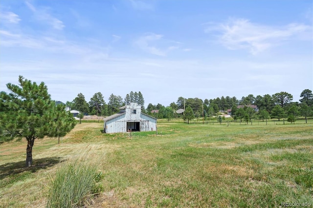 1233 Starling Ln, Elizabeth, CO 80107 - view of yard featuring a barn, an outbuilding, and a detached garage
