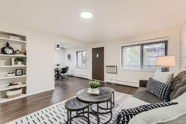 living room with a baseboard radiator, dark wood-type flooring, and a wall mounted AC