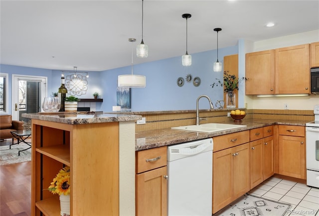 315 Arapahoe Ave Unit 202, Boulder, CO 80302 - kitchen with white appliances, a sink, open shelves, a peninsula, and hanging light fixtures