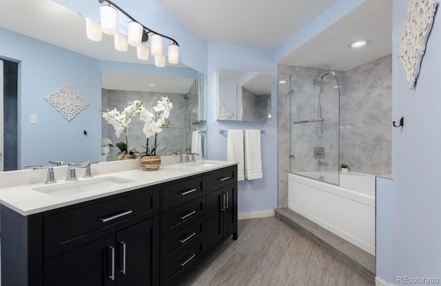 315 Arapahoe Ave Unit 202, Boulder, CO 80302 - full bathroom featuring wood finished floors, double vanity, shower / bathtub combination, and baseboards