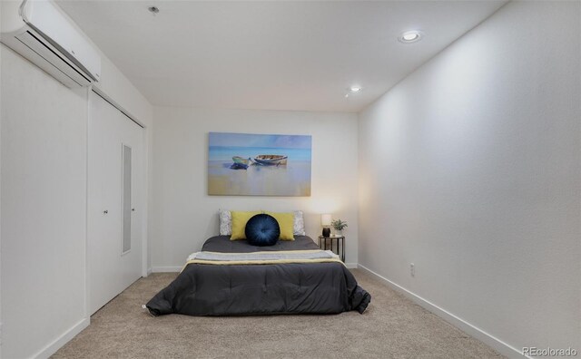 315 Arapahoe Ave Unit 202, Boulder, CO 80302 - carpeted bedroom featuring a wall mounted air conditioner, recessed lighting, and baseboards