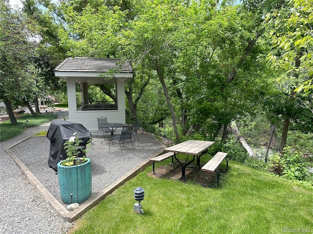 315 Arapahoe Ave Unit 202, Boulder, CO 80302 - view of community with a patio area and a lawn