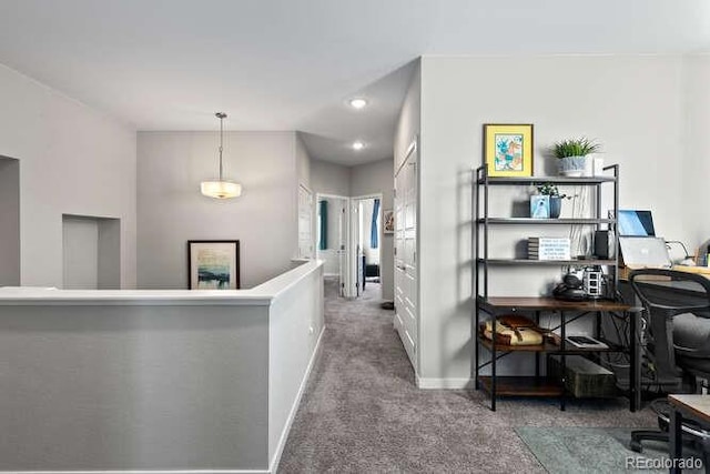 hallway with carpet floors