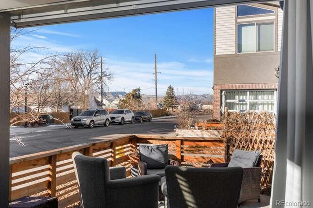 wooden balcony featuring a deck