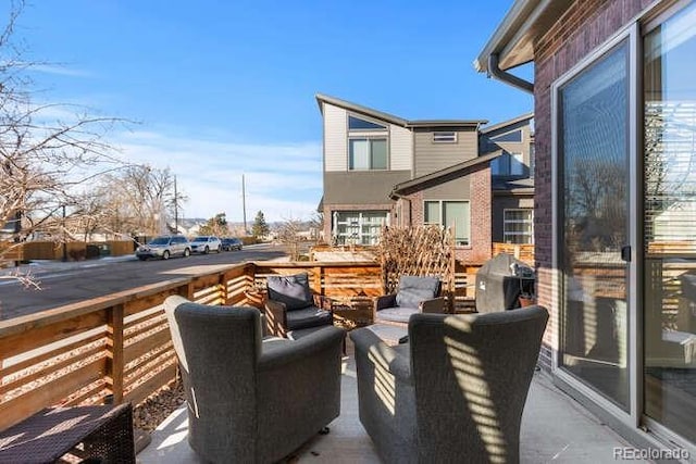 view of patio / terrace featuring a wooden deck and a grill