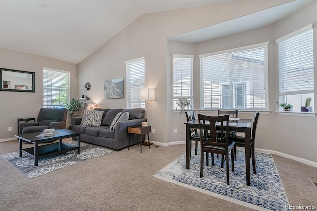 living room featuring vaulted ceiling, carpet, and baseboards