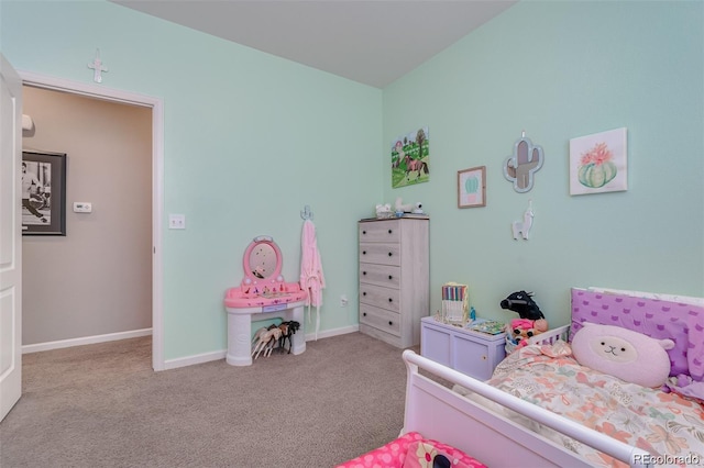 bedroom with baseboards and light colored carpet