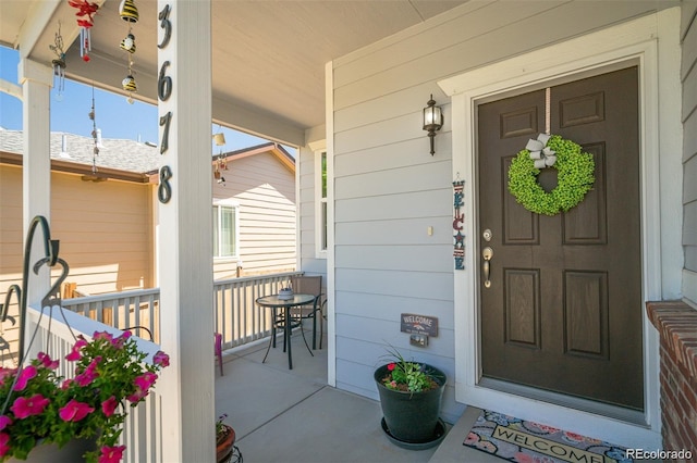 property entrance with covered porch