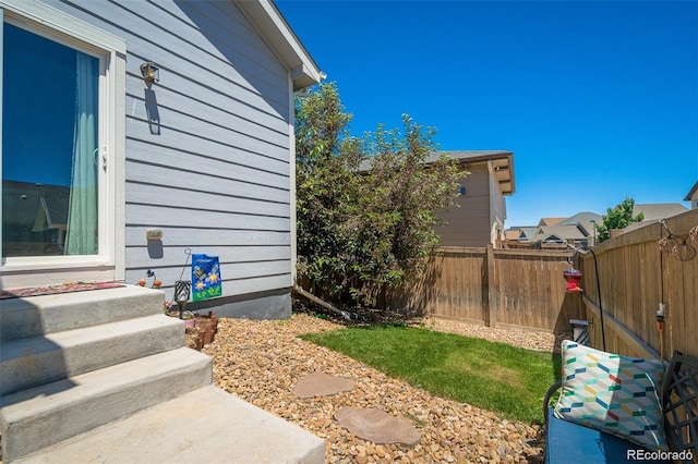 view of side of property with a fenced backyard