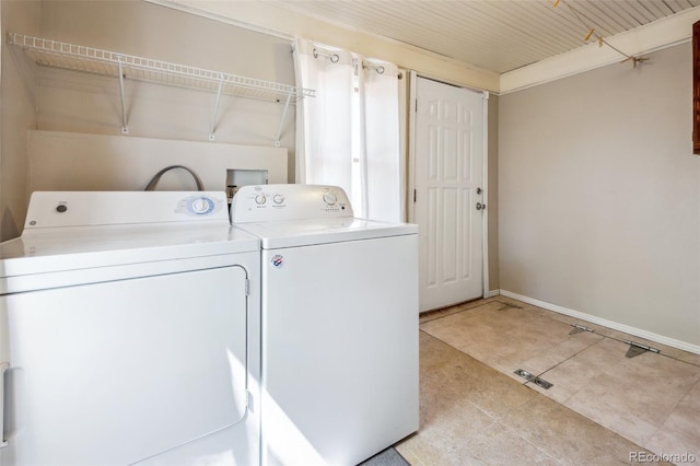 2119 W Pikes Peak Ave, Colorado Springs, CO 80904 - washroom with washing machine and clothes dryer, baseboards, and light tile patterned floors