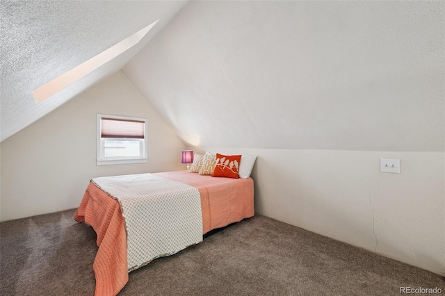 2119 W Pikes Peak Ave, Colorado Springs, CO 80904 - bedroom with carpet, a skylight, and lofted ceiling