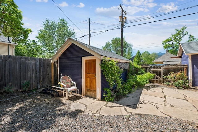 2119 W Pikes Peak Ave, Colorado Springs, CO 80904 - view of outdoor structure with a fenced backyard and a gate