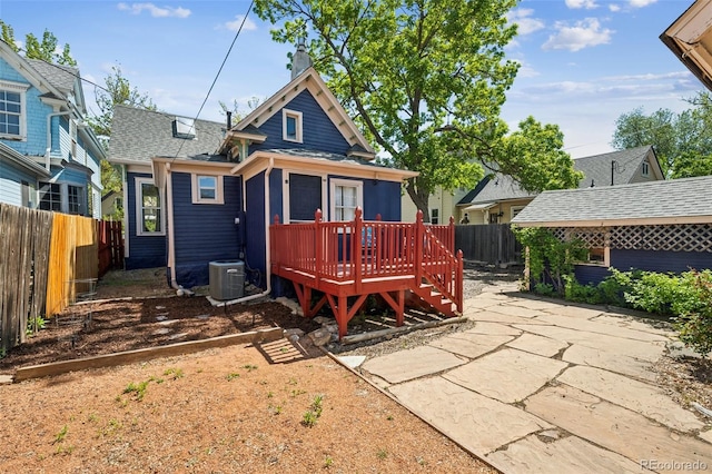 2119 W Pikes Peak Ave, Colorado Springs, CO 80904 - rear view of property with a wooden deck, a fenced backyard, a patio, and central AC unit