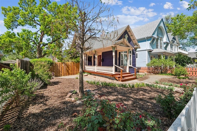 2119 W Pikes Peak Ave, Colorado Springs, CO 80904 - back of house featuring a porch and roof with shingles